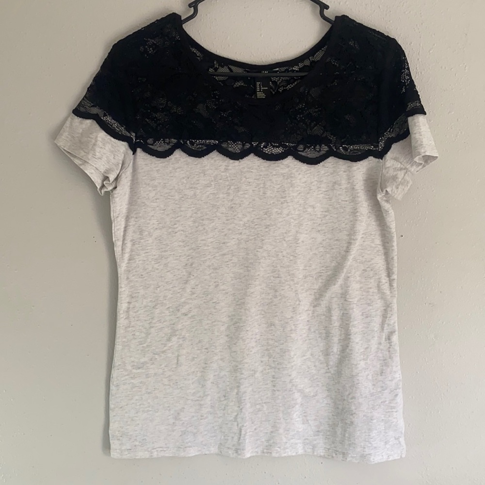 Grey tee with black lace on the top. Only wore once. Beautiful details